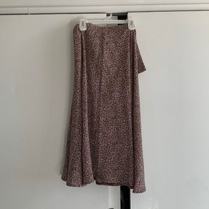 medium length skirt, never worn, there is a slit